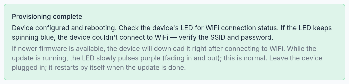 The green Provisioning complete notice: the device is configured and rebooting, with advice about the LED